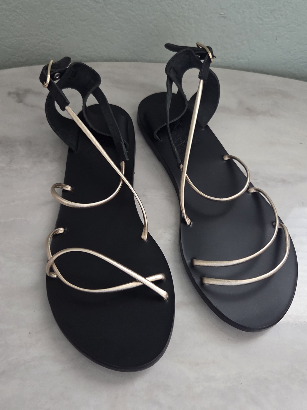 Ancient Greek Sandals Women's Black & Gold Strappy Flat Sandal $285